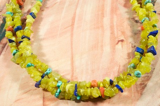 Beautiful 3 strand Necklace featuring Genuine Olive Jade with accents of Sleeping Beauty Turquoise, Blue Lapis and Jasper. Penshell Heishi, Sterling Silver Cones and Clasp. Created by Santo Domingo Artist Carol Pacheco. The Santo Domingo Pueblo is in New Mexico, near Santa Fe.
